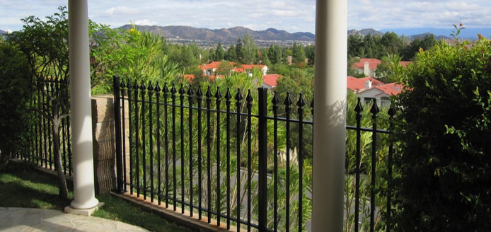 Beautiful Wrought iron fence over looking a villa.